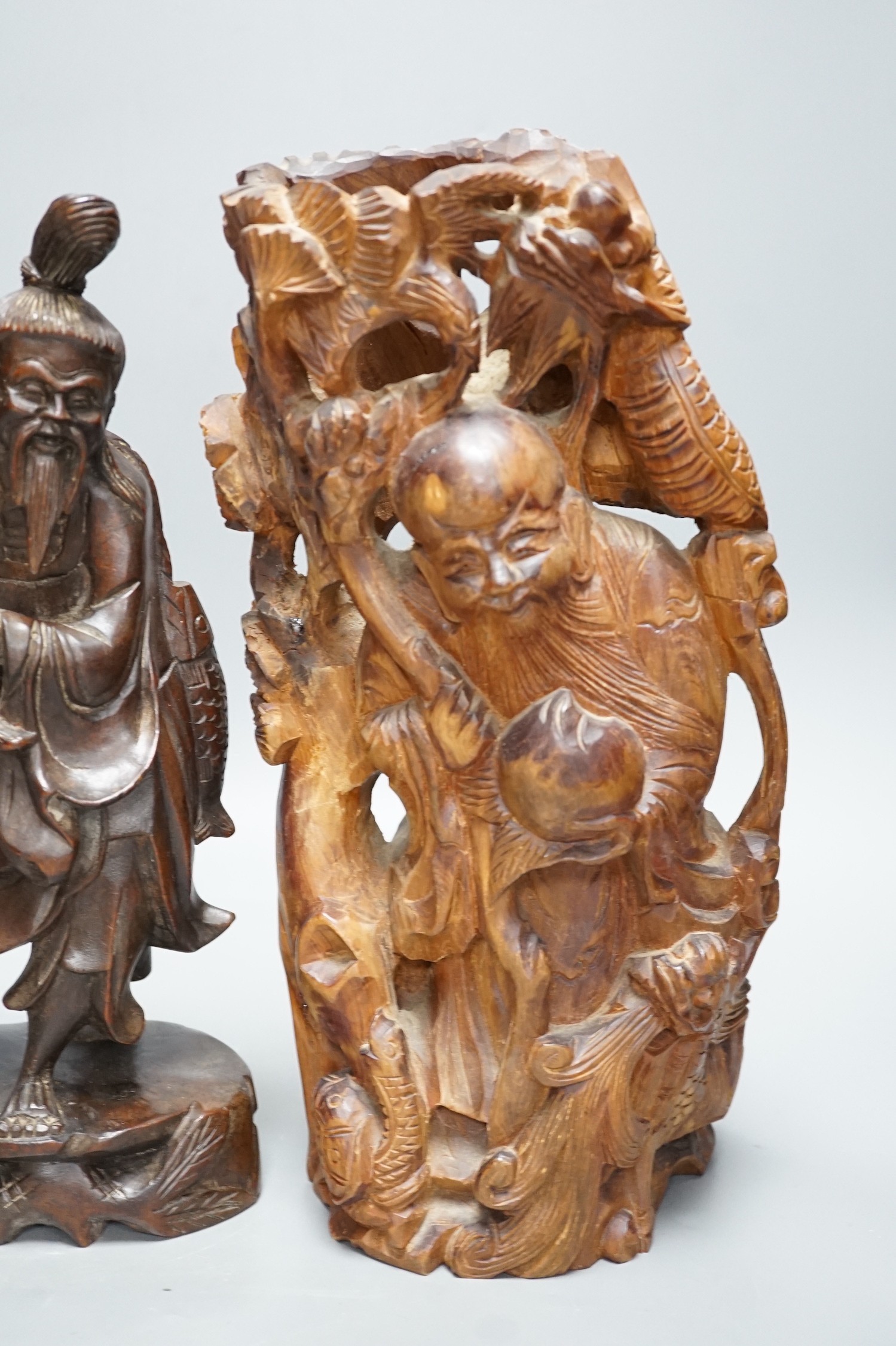 Two Chinese wooden figures and a Bizen pottery figure